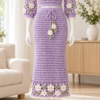 Lilac crochet lace top and midi skirt set with white flower appliques displayed on a mannequin in a bright room