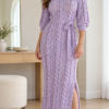 Lilac cable slit dress with vertical rope cables, ribbed neckline, bracelet sleeves, and scalloped hem styled with matching heels